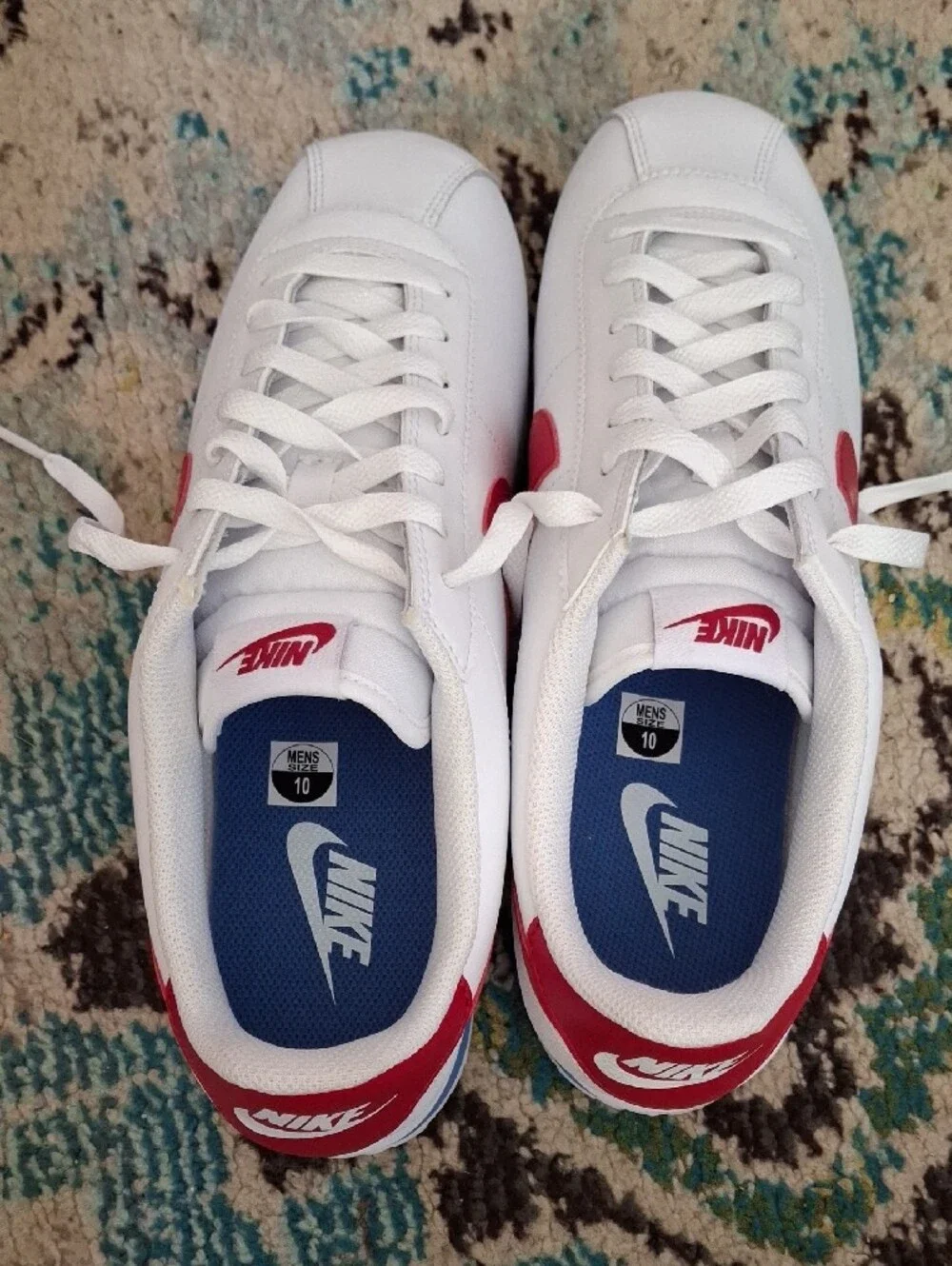Nike White Sneakers with Red Swoosh and Blue Stripe